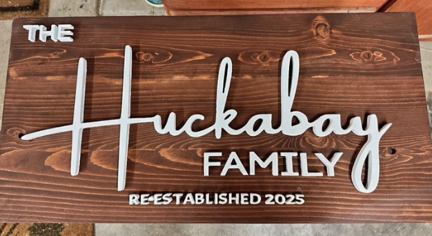Dimensional Huckabay family sign on stained wood